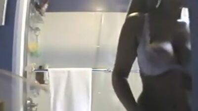 Peeping on naked busty roommate in the shower