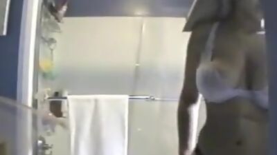 Peeping on naked busty roommate in the shower