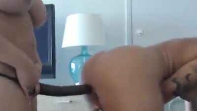 Lilly strapon fucks her big tits friend