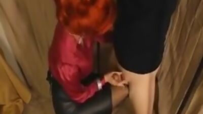 Mature redhead gives her slave slut a footjob
