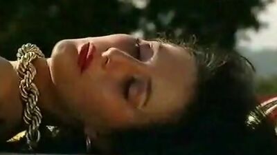 Busty bizarre babe fucks a gigantic dildo outdoors