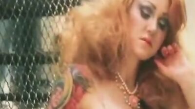 See Chesty show off her tattoos.