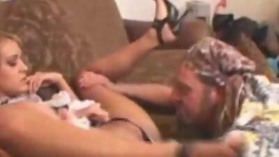 Trina Michaels sucks cock on her knees.