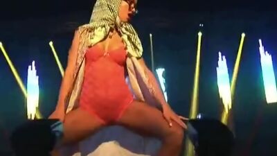 Doll fucks with dildo on stage