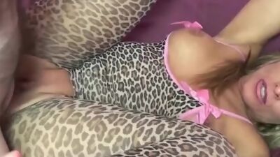 Mature blonde Skylar Rae in her crotchless leopard catsuit and getting fucked by a geek