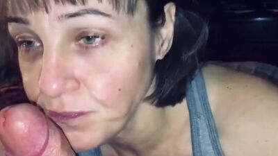 Horny mature slut throat fucks a POV dong and swallows his cum