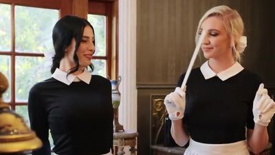 Sexy lesbian maids tribbing in bed