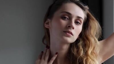 Busty ukrainian babe Yana West presenting a sensual striptease