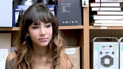 Teenage, latina suspect is taken to loss prevention office and informed that her theft has been caught on camera