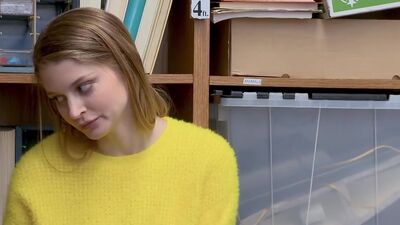 Female suspect apprehended and detained on suspicion of shoplifting, having hidden items under her sweater