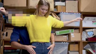 Female suspect apprehended and detained on suspicion of shoplifting, having hidden items under her sweater