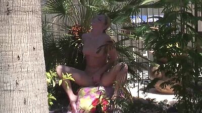 Amateur blonde rubbing her pussy in the backyard
