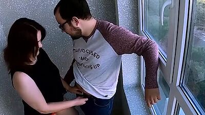 The guy looks at the neighbors while she licks his ass