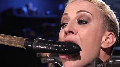 BDSM sub bound to floor and toyed with dildo and vibrator