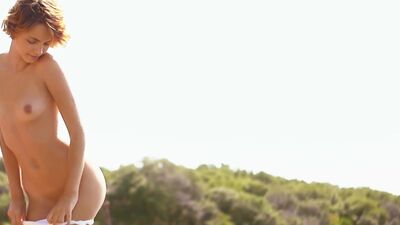 Small tits model Ariel posed totally naked outdoor and she exposed her body