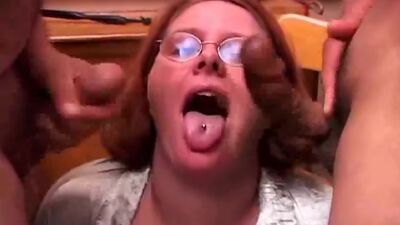 Cute chubby redhead enjoys a double header and a big mouthful of cum