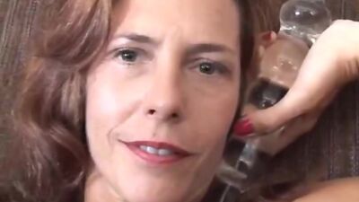 Gorgeous mature redhead fucks her pussy and asshole