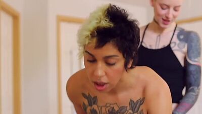 Tattooed masc dykes take turns strapon fucking each other